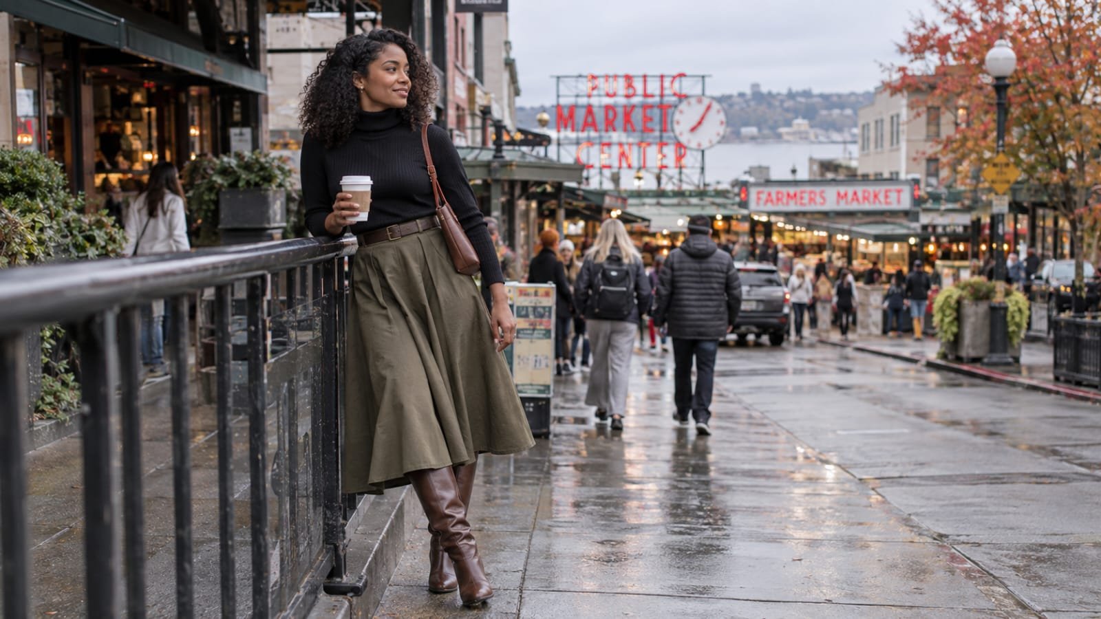 Olive A-line midi skirt with a black turtleneck and brown knee-high boots.